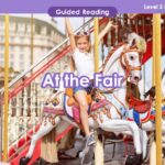 A girl is riding a carousel at the fair, enjoying the K-12 environment.